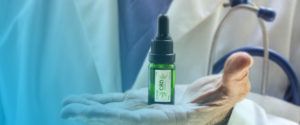 Is CBD Safe? Doctor holding CBD.
